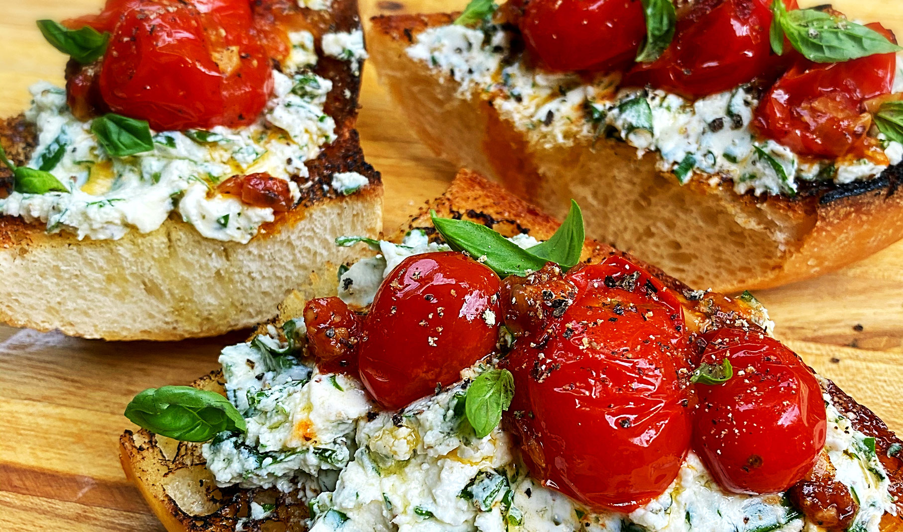 Garlic and Herb Goat Cheese Toasts with Blistered Tomatoes